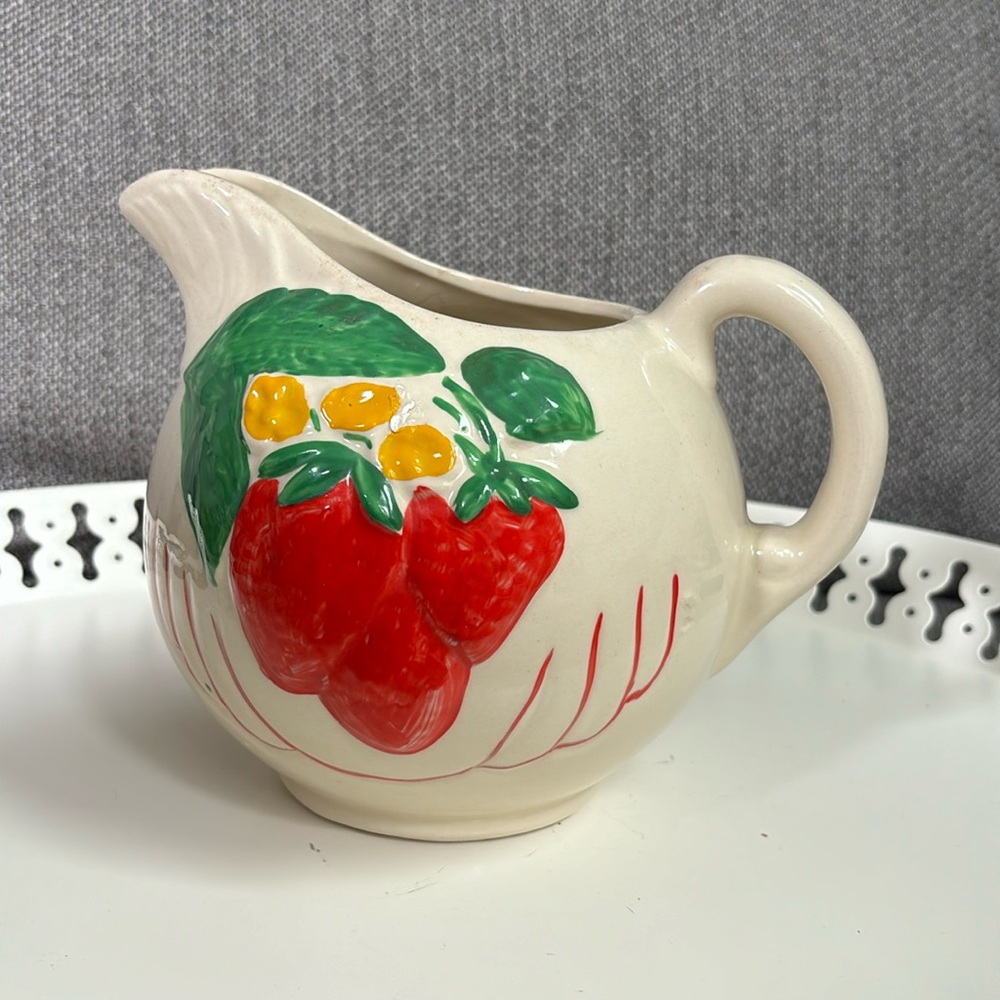 Strawberry ball pitcher American Bisque Pottery Co stamped USA on the bottom.